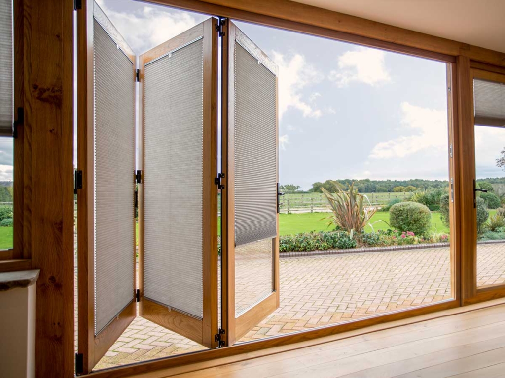 Recess-fitted Duette® Blinds in Folding Doors