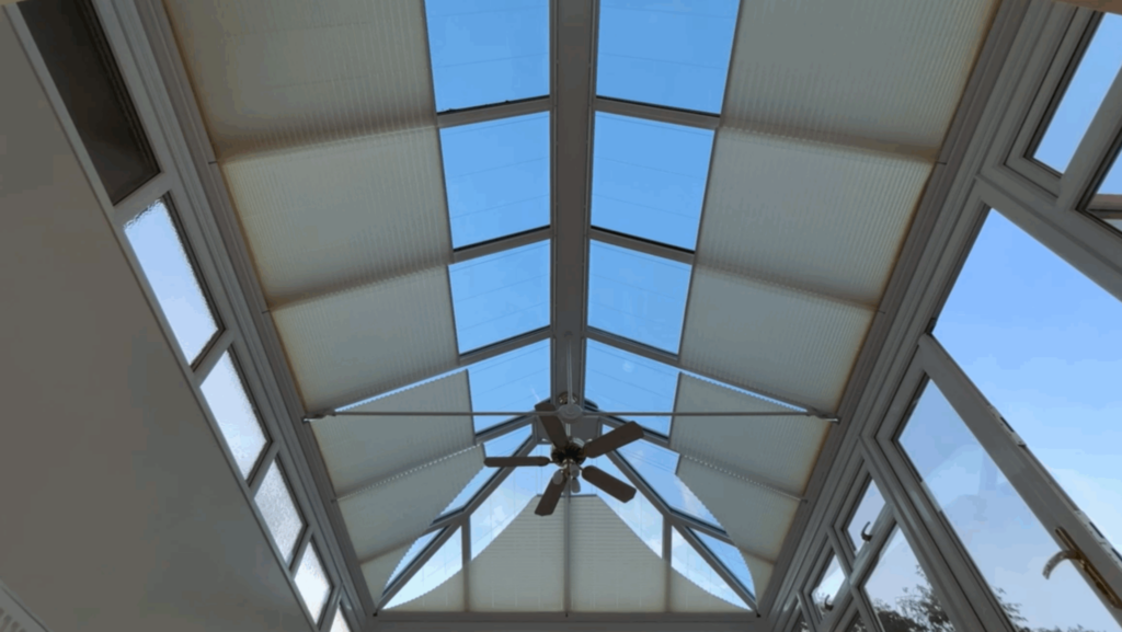 Opening roof lantern blinds and a blue sky