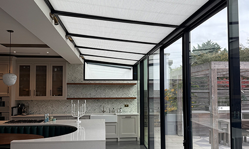 Well lit kitchen with white roof lantern blinds