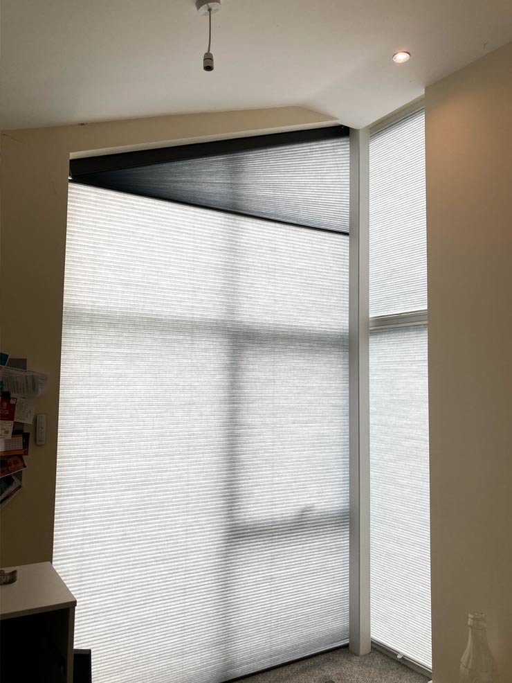 Corner triangle blinds for angled window